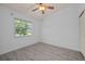 Well-lit bedroom featuring wood-look floors and ceiling fan at 1512 Rio De Janeiro Ave # 327, Punta Gorda, FL 33983