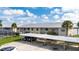 Condo building with carport parking and lake view at 1512 Rio De Janeiro Ave # 327, Punta Gorda, FL 33983