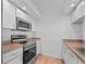 Kitchen with stainless steel appliances and brown countertops at 1512 Rio De Janeiro Ave # 327, Punta Gorda, FL 33983