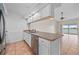 Modern kitchen features stainless steel appliances and tile flooring at 1512 Rio De Janeiro Ave # 327, Punta Gorda, FL 33983