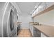 Stainless steel appliances and light brown countertops in this kitchen at 1512 Rio De Janeiro Ave # 327, Punta Gorda, FL 33983