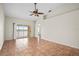 Spacious living room with tile floors and access to a balcony at 1512 Rio De Janeiro Ave # 327, Punta Gorda, FL 33983