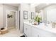 Modern bathroom with double vanity and walk-in shower at 107 Santarem Cir, Punta Gorda, FL 33983