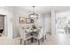 Elegant dining room with glass table and chandelier at 107 Santarem Cir, Punta Gorda, FL 33983