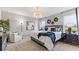 Spacious main bedroom with plush bedding and large windows at 107 Santarem Cir, Punta Gorda, FL 33983