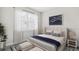 Spacious bedroom with a large bed, neutral color palette, and ample natural light at 16024 Crofton Springs Way, Port Charlotte, FL 33953