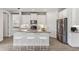 Modern kitchen with white cabinets, granite countertops, and stainless steel appliances at 16024 Crofton Springs Way, Port Charlotte, FL 33953