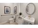 Accessible bathroom with single vanity, toilet, and grab bars at 16130 Highgate St, Port Charlotte, FL 33953