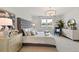 Elegant main bedroom with a large bed, comfortable seating, and plenty of natural light at 16130 Highgate St, Port Charlotte, FL 33953