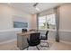 Home office featuring a desk, chairs, and large window at 16130 Highgate St, Port Charlotte, FL 33953