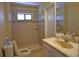 Bathroom with shower, sink, and toilet at 5405 Ulysses St, Port Charlotte, FL 33981