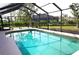 Wider view of the refreshing screened-in pool at 5405 Ulysses St, Port Charlotte, FL 33981