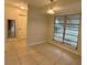 Bright dining room with tile floor and view to backyard at 22180 Midway Blvd, Port Charlotte, FL 33952