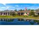 Home with a large backyard that leads to a serene pond view at 24723 Rio Villa Lakes Cir, Punta Gorda, FL 33950