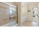 Bathroom boasts tiled shower with glass doors and separate soaking tub at 24723 Rio Villa Lakes Cir, Punta Gorda, FL 33950