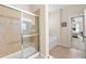 Bathroom featuring a glass-enclosed shower, tile floor, and a separate soaking tub at 24723 Rio Villa Lakes Cir, Punta Gorda, FL 33950