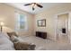 Sitting room with couch, mirror and view to next room at 24723 Rio Villa Lakes Cir, Punta Gorda, FL 33950