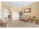 Living room with neutral walls, tile flooring, and comfortable seating at 24723 Rio Villa Lakes Cir, Punta Gorda, FL 33950
