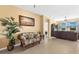 Cozy living room with neutral walls, tile flooring, comfortable seating, and stylish decor at 24723 Rio Villa Lakes Cir, Punta Gorda, FL 33950
