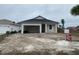 Newly constructed one-story home with attached garage and partial landscaping at 4250 Oak Terrace Cir, Port Charlotte, FL 33953