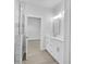 Clean bathroom with white cabinets and marble shower at 13164 Amaryllis Cir, Port Charlotte, FL 33981