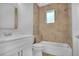 Bathroom with a tub and beige tile at 13164 Amaryllis Cir, Port Charlotte, FL 33981
