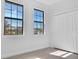 Bedroom with two windows and a closet at 13164 Amaryllis Cir, Port Charlotte, FL 33981