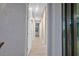 Long hallway with light-colored walls and flooring at 13164 Amaryllis Cir, Port Charlotte, FL 33981