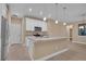 Island kitchen with white shaker cabinets and granite countertops at 13164 Amaryllis Cir, Port Charlotte, FL 33981