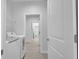 Laundry room with washer, dryer, and access to other rooms at 13164 Amaryllis Cir, Port Charlotte, FL 33981