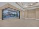 Living area with sliding glass doors opening to a relaxing pool and patio at 13164 Amaryllis Cir, Port Charlotte, FL 33981