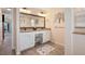 Double vanity bathroom with a large mirror and seating area at 2615 Rio Plato Dr, Punta Gorda, FL 33950