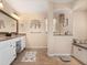 Double vanity, large mirror, and built-in bench with storage at 2615 Rio Plato Dr, Punta Gorda, FL 33950