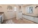 Bathroom boasts a built-in bench, double vanity, and tiled flooring at 2615 Rio Plato Dr, Punta Gorda, FL 33950