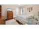Bedroom with a dresser, TV, and starfish-themed bedding at 2615 Rio Plato Dr, Punta Gorda, FL 33950