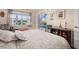 Bedroom with pool view and sitting area with a comfortable chair at 2615 Rio Plato Dr, Punta Gorda, FL 33950