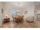 Bright dining room with wood table and chairs, and tiled floor at 2615 Rio Plato Dr, Punta Gorda, FL 33950