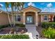 Inviting entryway with a teal front door and landscaped walkway at 2615 Rio Plato Dr, Punta Gorda, FL 33950