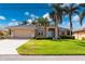 Single-story home with attached garage and well-manicured lawn at 2615 Rio Plato Dr, Punta Gorda, FL 33950