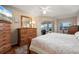 Main bedroom with wood furniture and access to the pool at 2615 Rio Plato Dr, Punta Gorda, FL 33950