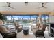 Relaxing screened-in pool area with wicker furniture at 2615 Rio Plato Dr, Punta Gorda, FL 33950