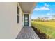 Side entrance with paver walkway leading to the door at 11247 Boundless Ter, Venice, FL 34293