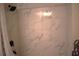 Bathroom with marble tile shower and modern fixtures at 956 Harbor Town Dr, Venice, FL 34292