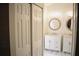 Elegant bathroom with double vanity, marble flooring, and round mirrors at 956 Harbor Town Dr, Venice, FL 34292