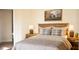 Cozy bedroom featuring a wood-framed bed, matching nightstands, and lamps at 956 Harbor Town Dr, Venice, FL 34292