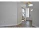 Light and airy foyer with wood-look flooring, transom window, and entry door at 956 Harbor Town Dr, Venice, FL 34292