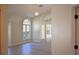 Bright living room with arched windows and a ceiling fan at 956 Harbor Town Dr, Venice, FL 34292