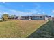 House exterior and expansive grassy backyard at 4511 Gillen St, Port Charlotte, FL 33948