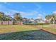 Landscaped backyard with canal access and boat dock at 4511 Gillen St, Port Charlotte, FL 33948