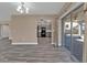 Dining area with gray floor and view into the kitchen at 4511 Gillen St, Port Charlotte, FL 33948